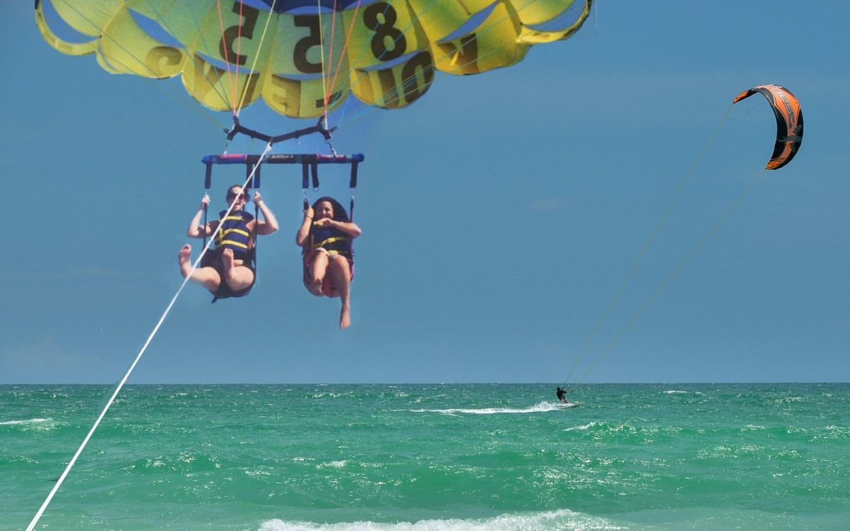 people parasailing over ocean
