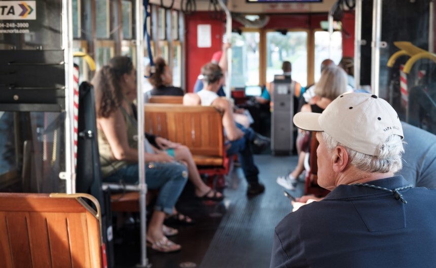 people riding the trolley