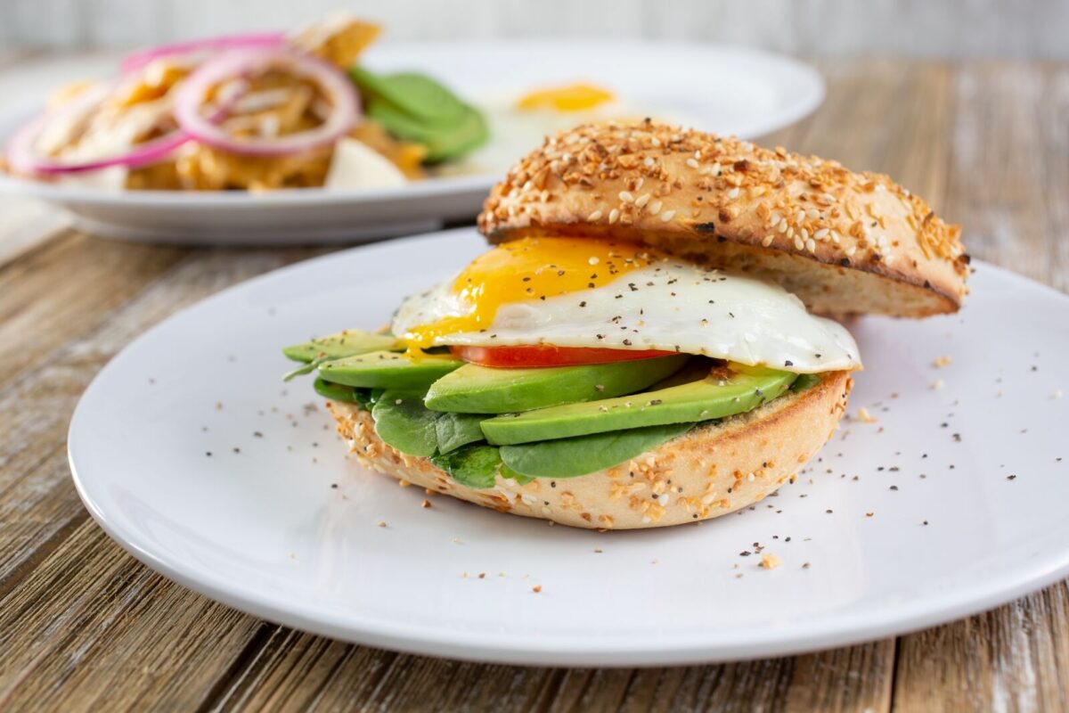Bagel sandwich with egg and avocado.