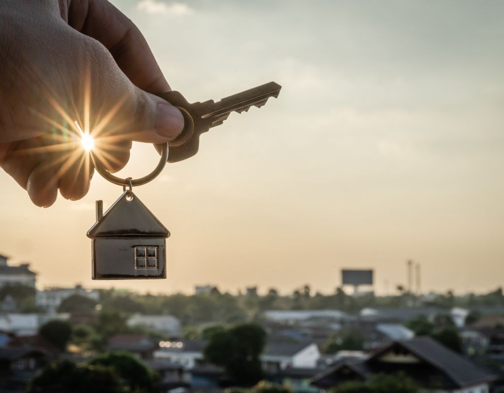 holding a key over a city